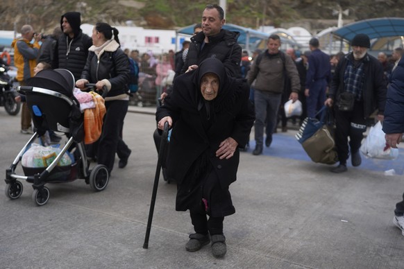 Flora Karamolegou, 94, said she survived a deadly earthquake on Santorini in 1956, as she boards a ferry bound for the Greek mainland, in the earthquake-struck Greek island, Tuesday, Feb. 4, 2025. (AP ...