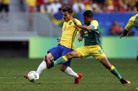 2016 Rio Olympics - Soccer - Preliminary - Men&#039;s First Round - Group A Brazil v South Africa - Mane Garrincha Stadium - Brasilia, Brazil - 04/08/2016. Zeca (BRA) of Brazil and Keagan Dolly (RSA)  ...