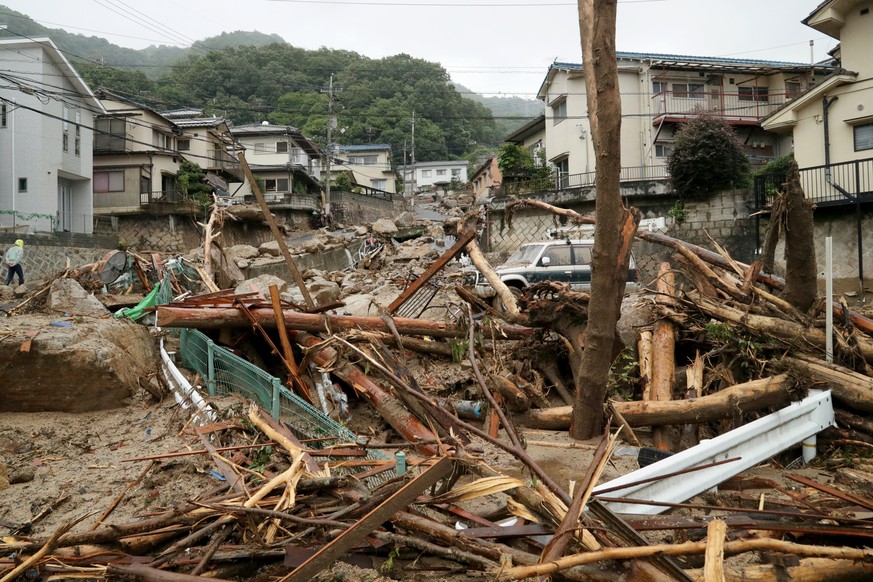 epa06873708 Flood by heavy rain damage a residential district in Hiroshima, Hiroshima Prefecture, western Japan, 08 July 2018. Heavy rainfall killed 81 people and missing 58 people at least in southwe ...