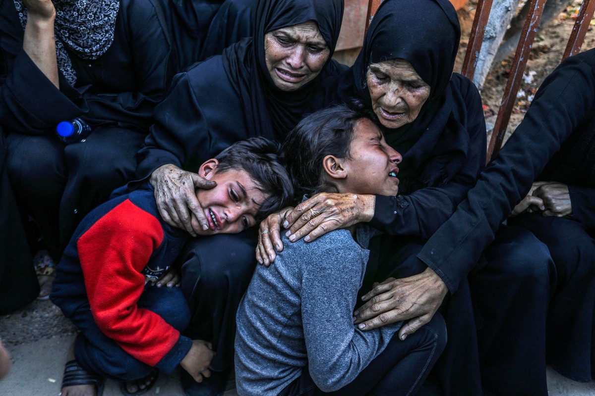 KHAN YUNIS, GAZA - MAY 21: Relatives and loved ones of Palestinians, who lost their lives in Israeli attacks, mourn for their deceased ones at Nasser Hospital as funeral procedures are underway in Kha ...