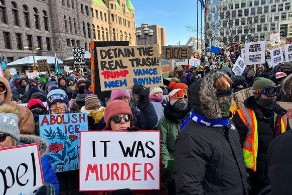 People participate in an anti-ICE rally Sunday, Jan. 25, 2026, in Minneapolis. (AP Photo/Jack Brook)
