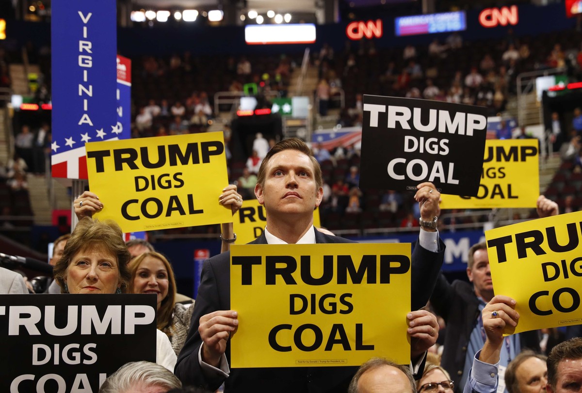 Delegates from West Virginia hold signs supporting coal on the second day of the Republican National Convention in Cleveland, Ohio, U.S. July 19, 2016. REUTERS/Aaron P. Bernstein/File Photo