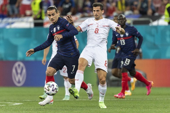 epa09309193 France&#039;s Antoine Griezmann (L) in action against Switzerland&#039;s Remo Freuler (R) during the UEFA EURO 2020 round of 16 soccer match between France and Switzerland in Bucharest, Ro ...