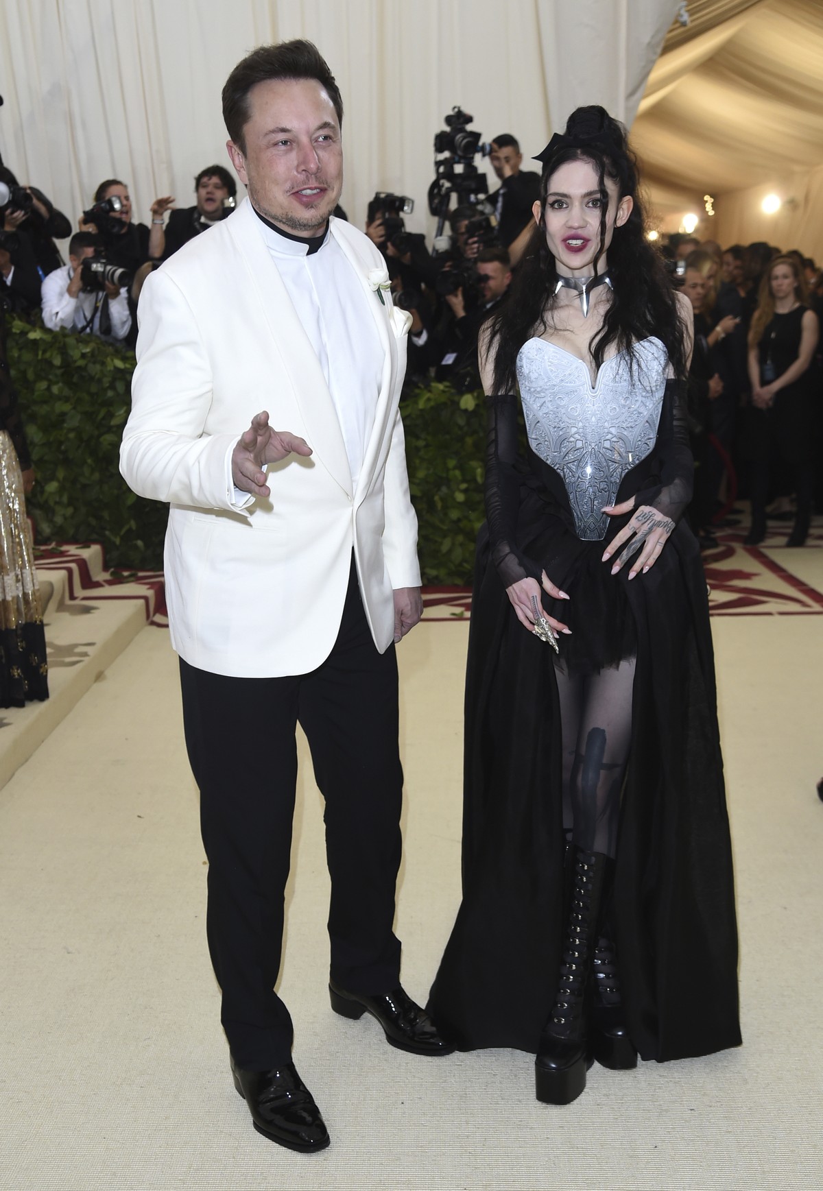 Elon Musk, left and Grimes attend The Metropolitan Museum of Art's Costume Institute benefit gala celebrating the opening of the Heavenly Bodies: Fashion and the Catholic Imagination exhibition o ...