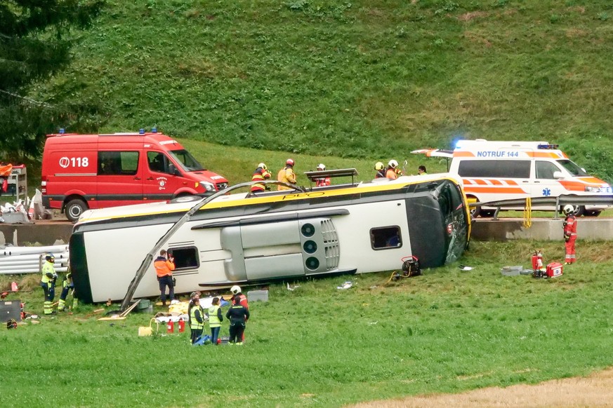 epa13229696 Emergency responders at the scene of an accident involving a travel coach in Susch in the canton of Grisons, Switzerland, 10 September 2026. Several people died in a tour bus accident on t ...