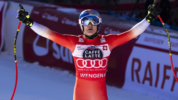 Marco Odermatt of Switzerland reacts in the finish area during the men's Downhill race at the Alpine Skiing FIS Ski World Cup, in Wengen, Switzerland, Saturday, January 18, 2025. (KEYSTONE/Peter  ...