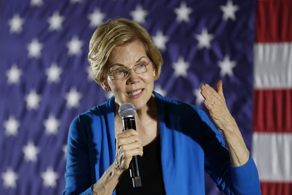 FILE - In this Friday, May 3, 2019 file photo, 2020 Democratic presidential candidate Sen. Elizabeth Warren speaks to local residents during an organizing event, in Ames, Iowa. Warren is bringing her  ...