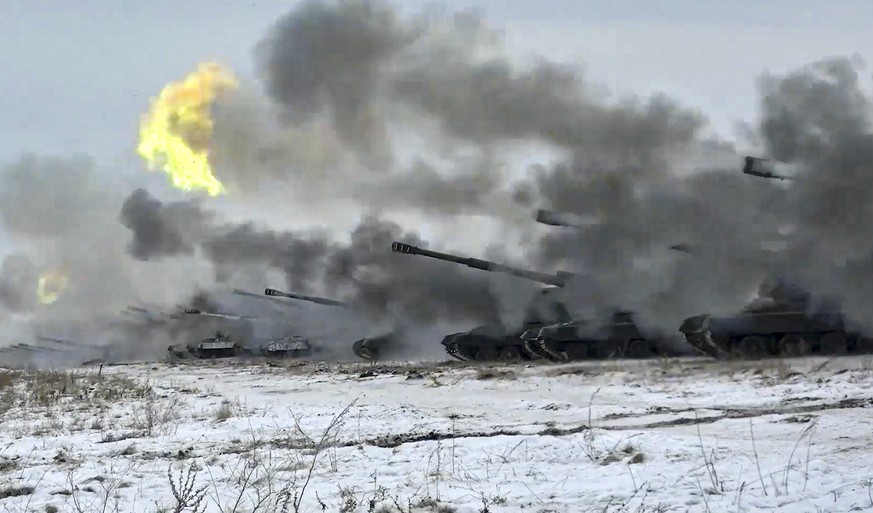 FILE - In this image taken from video and released by Russian Defense Ministry Press Service, Russian army&#039;s self-propelled howitzers fire during military drills near Orenburg in the Urals, Russi ...