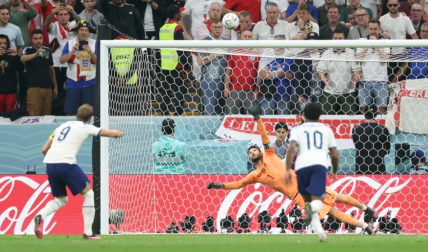 epa10360268 Harry Kane of England (L) fails to score by penalty during the FIFA World Cup 2022 quarter final soccer match between England and France at Al Bayt Stadium in Al Khor, Qatar, 10 December 2 ...