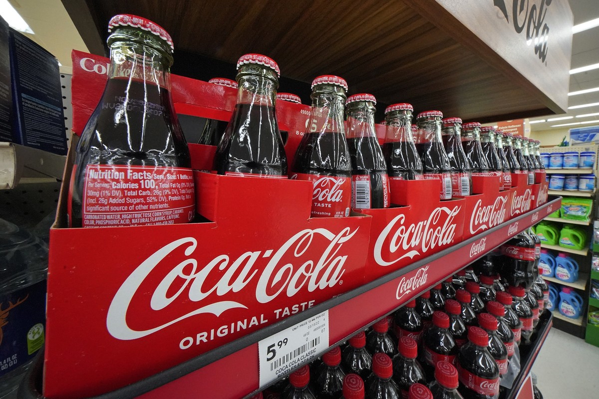 Bottles of Coca-Cola are on display at a grocery market in Uniontown, Pa, on Sunday, April 24, 2022. Coca-Cola raised prices to offset inflation and on Tuesday, Feb. 14, 2023, it said that it didn ...
