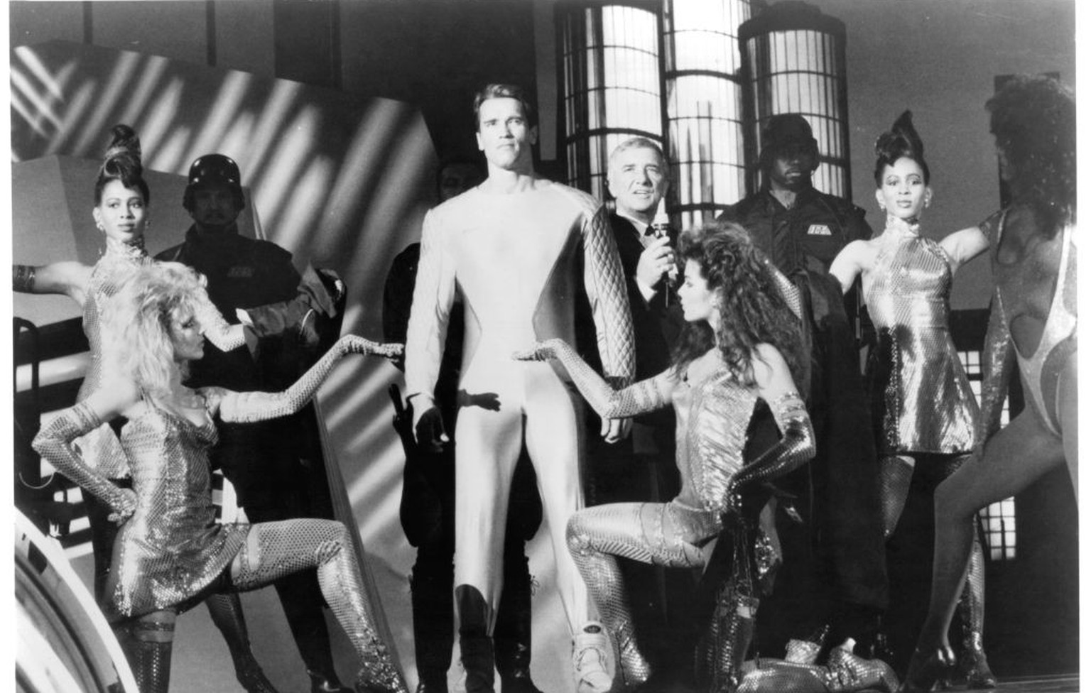 Actors Richard Dawson and Arnold Schwarzenegger on set of the movie &quot;The Running Man&quot; in 1987. (Photo by Michael Ochs Archives/Getty Images)