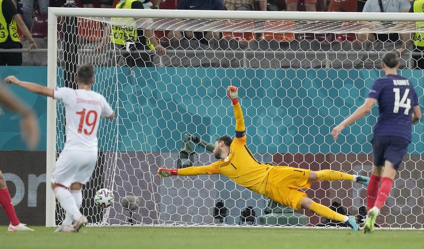 Switzerland's Mario Gavranovic shoots to score his side's third goal during the Euro 2020 soccer championship round of 16 match between France and Switzerland at the National Arena stadium i ...