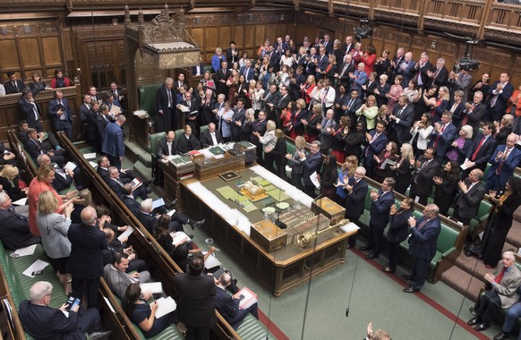 epa07830695 A handout photo made available by the UK Parliament shows Speaker of the House of Commons John Bercow (C-L) being applauded in the House of Commons in London, Britain, 09 September 2019. R ...