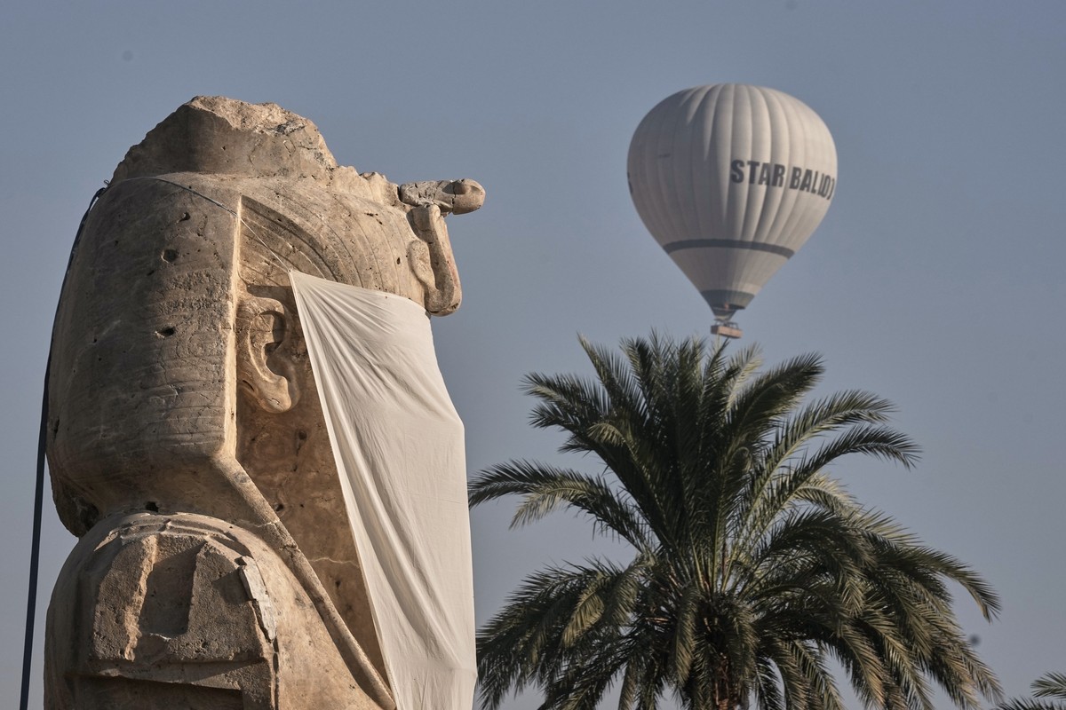 A hot air balloon flies over the reassembled alabaster statues for Pharoah Amenhotep III, in the southern city of Luxor, Egypt, Sunday, Dec. 14, 2025. (AP Photo/Amr Nabil)
Egypt Antiquities