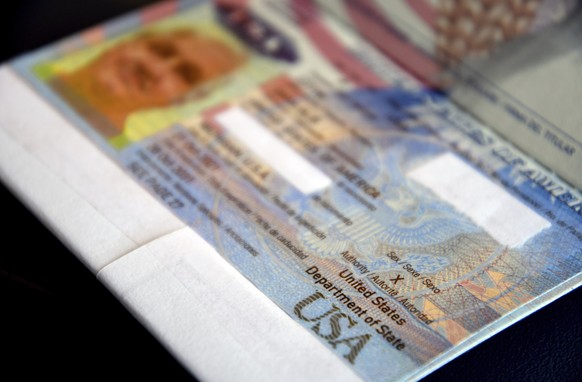 PASSPORT REDACTED WITH WHITE TAPE BY PASSPORT HOLDER - A passport belonging to Dana Zzyym rests on a table, Wednesday, Oct. 27, 2021, in Fort Collins, Colo. Zzyym, who prefers a gender-neutral pronoun ...