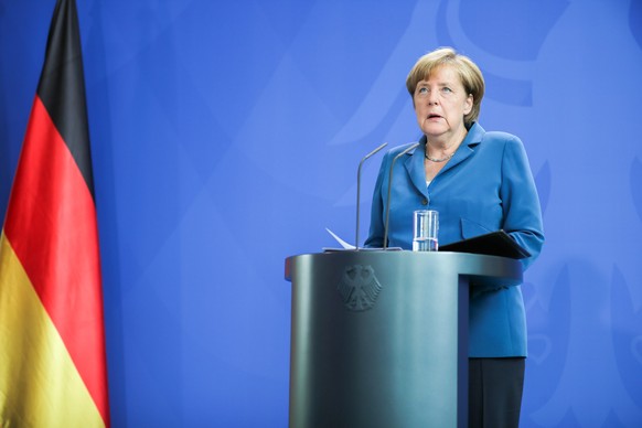 epa05437928 German Chancellor Angela Merkel makes a statement on the shootings in Munich at the Chancellery in Berlin,Â Germany, 23 July 2016. Police on 23 July 2016 said it was a &#039;classical amok ...