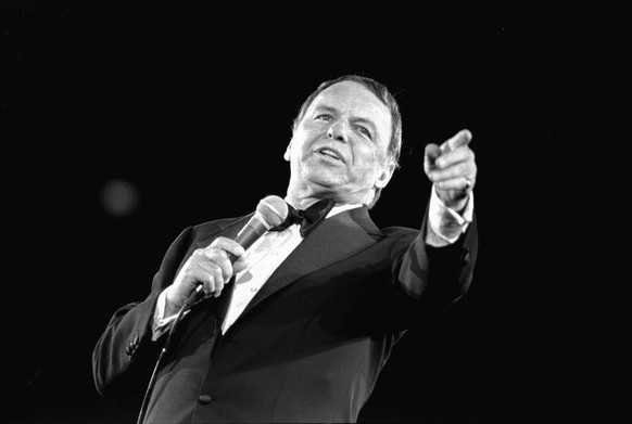 This April 9, 1974 file photo shows Frank Sinatra performing at the Nassau Veterans Memorial Coliseum, in Uniondale, NY. Sinatra, who died in 1998, at 82, would have celebrated his 100th birthday on D ...