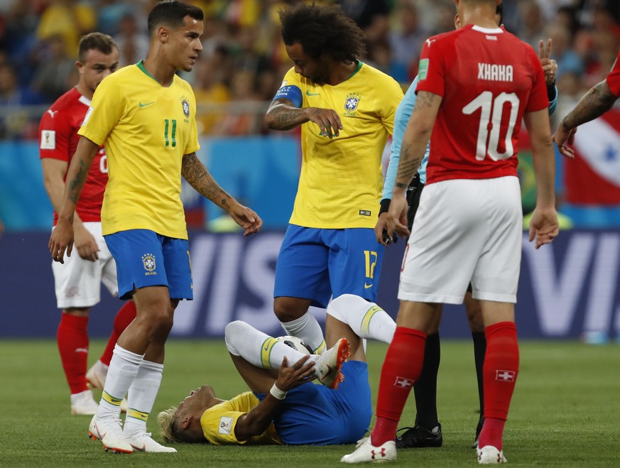 Brazil's Neymar lies on the ground during the group E match between Brazil and Switzerland at the 2018 soccer World Cup in the Rostov Arena in Rostov-on-Don, Russia, Sunday, June 17, 2018. (AP Ph ...