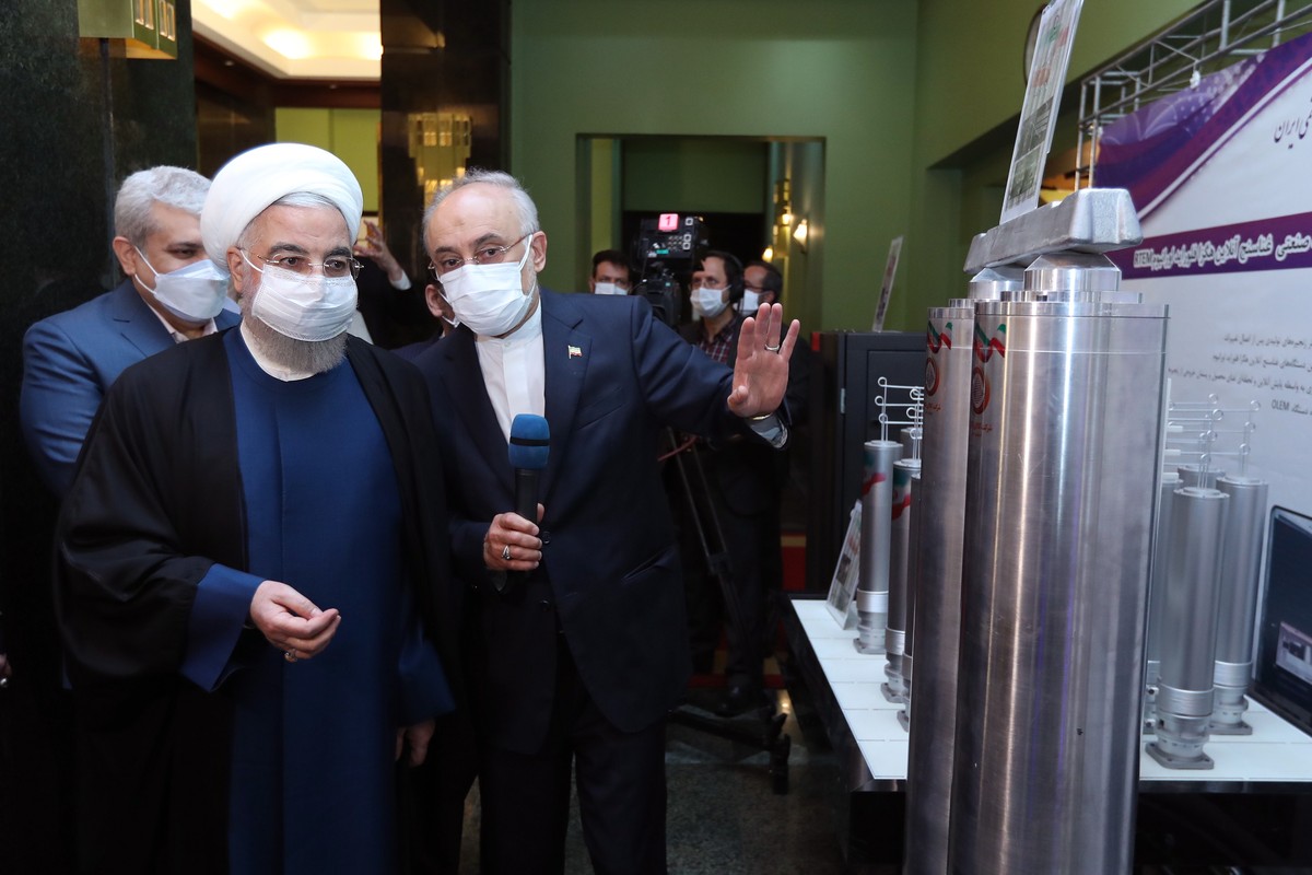 epa09126293 A handout picture made available by the Iranian presidential office shows Iranian President Hassan Rouhani (L) and head of Iran's nuclear organization Ali Akbar Salehi (R) visits an e ...