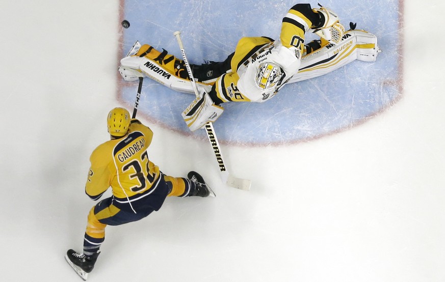 In this June 3, 2017 photo, Nashville Predators left wing Frederick Gaudreau (32) shoots against Pittsburgh Penguins goalie Matt Murray (30) during Game 3 of the NHL hockey Stanley Cup Finals, Saturda ...