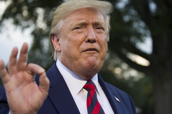 President Donald Trump speaks with reporters before departing on Marine One from the South Lawn of the White House, Thursday, Sept. 12, 2019, in Washington. Trump is en route to Baltimore.(AP Photo/Al ...