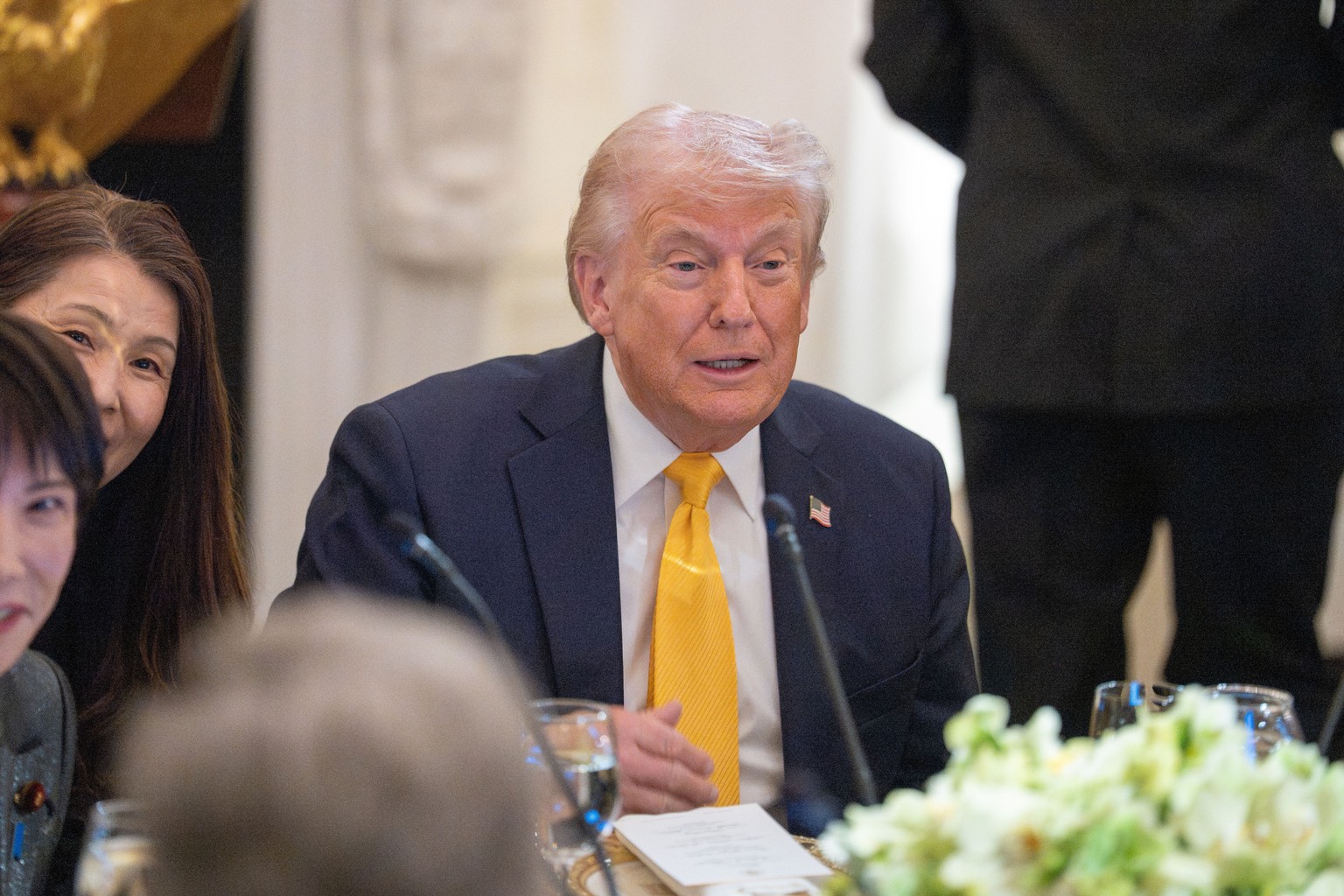 epa12834926 United States President Donald Trump reacts during a bilateral dinner with Prime Minster Takeuchi Sanae of Japan in the State Dining Room of the White House in Washington DC, USA, 19 March ...