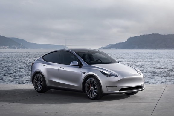 This photo provided by Tesla shows the 2024 Model Y. This popular small electric SUV can go up to an estimated 320 miles on a full charge. (Courtesy of Tesla Motors via AP)