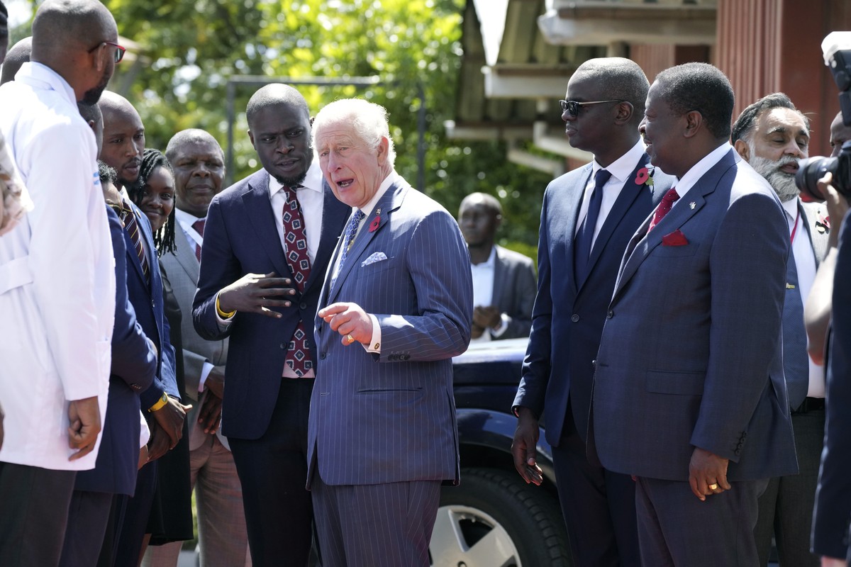 Britain's King Charles III, center, arrives at City Shamba, an urban farming project at Mama Lucy Hospital in Nairobi, Tuesday, Oct. 31, 2023. King Charles is in Kenya for a four-day trip, his fi ...