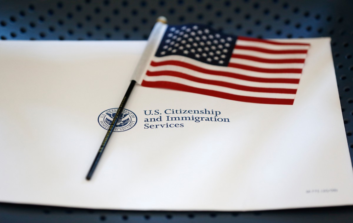 FILE - An information packet and an American flag are placed on a chair at the U.S. Citizenship and Immigration Services Miami Field Office on Aug. 17, 2018, in Miami. (AP Photo/Wilfredo Lee, File)
Mi ...