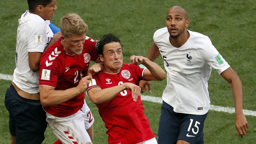 epa06841810 Andreas Cornelius of Denmark (2-L), Thomas Delaney of Denmark (2-R), Raphael Varane of France (L) and Steven Nzonzi of France in action during the FIFA World Cup 2018 group C preliminary r ...
