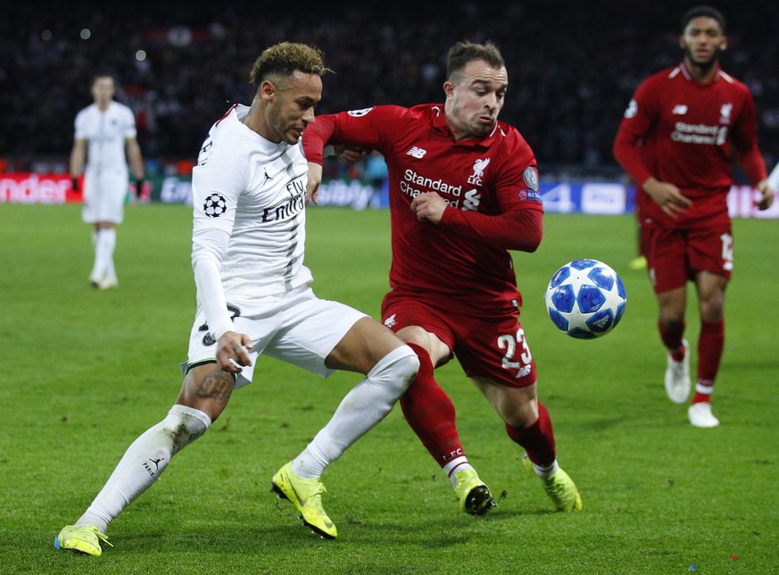 PSG forward Neymar, left, challenges for the ball with Liverpool midfielder Xherdan Shaqiri during a Champions League Group C soccer match between Paris Saint Germain and Liverpool at the Parc des Pri ...