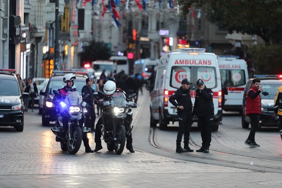 epa10303639 Turkish policemen try to secure the area after an explosion at Istiklal Street in Istanbul, Turkey, 13 November 2022. According to governor Ali Yerlikaya, an explosion that occurred at rou ...