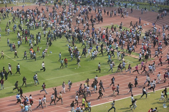 epa12588675 Fans throw bottles and chairs, vandalising hoardings at Salt Lake Stadium in Kolkata, West Bengal, India, 13 December 2025. Following Messi?s brief five-minute appearance, unrest broke out ...