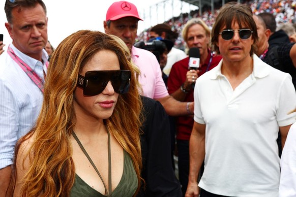 MIAMI, FLORIDA - MAY 07: Shakira and Tom Cruise walk on the grid prior to the F1 Grand Prix of Miami at Miami International Autodrome on May 07, 2023 in Miami, Florida. (Photo by Dan Istitene - Formul ...