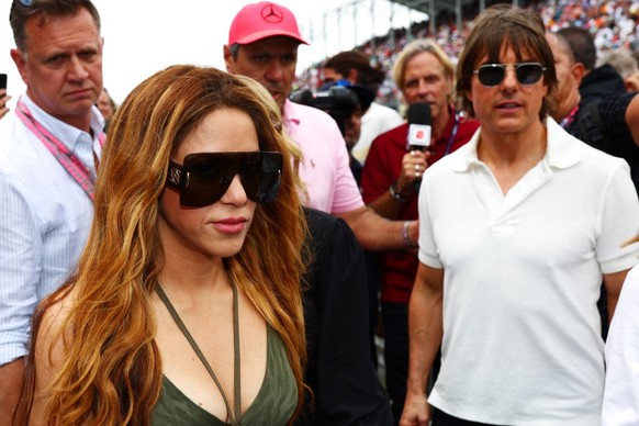 MIAMI, FLORIDA - MAY 07: Shakira and Tom Cruise walk on the grid ahead of the F1 Grand Prix of Miami at Miami International Autodrome on May 07, 2023 in Miami, Florida.  (Photo by Dan Istitene - Formula…