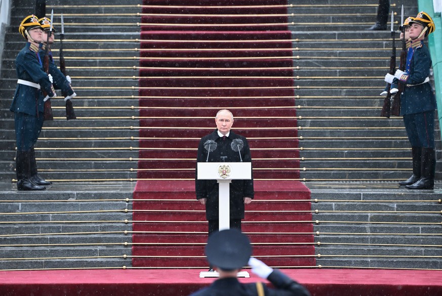 epa11324714 Russian President Vladimir Putin (C) takes part in the parade of the Presidential Regiment on the Kremlin&#039;s Cathedral Square after the inauguration ceremony in the Kremlin in Moscow,  ...