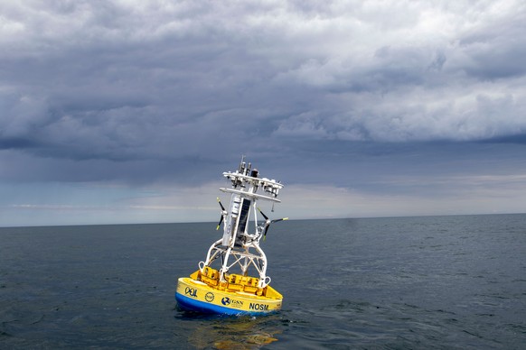 In this 2018 image provided by Woods Hole Oceanographic Institution, a buoy used to gather data floats in the Pioneer Mid-Atlantic Bight off the coast of North Carolina. (Darlene Trew Crist/Woods Hole ...