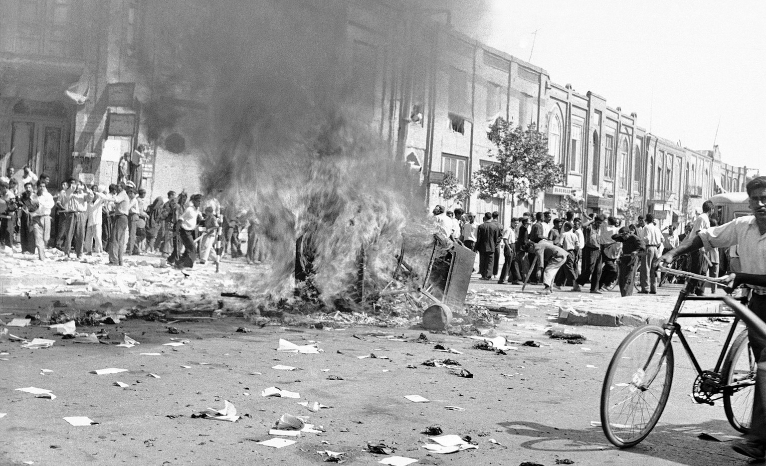 FILE -- In this August 19, 1953 file photo, office equipment of a Communist newspaper is burned in a Tehran street, during the pro-Shah riot which swept through the capital. On Tuesday, Aug. 27, 2013, ...