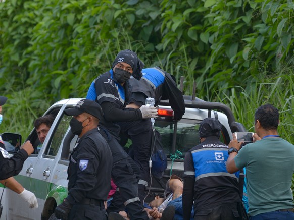 epa09936426 An injured inmate is transferred to a hospital from the Bellavista prison in Santo Domingo, Ecuador, 09 May 2022. At least two prisoners died and five others were injured this 09 May in a  ...