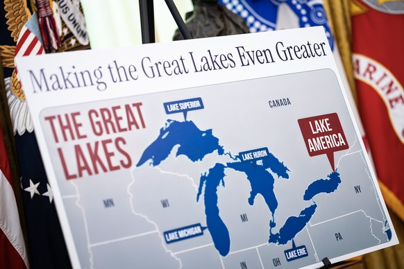 epa13195217 A poster shows the name change from Lake Ontario to Lake America, as US President Donald Trump signs an executive order on the renaming, amid a recent trade war, in the Oval Office of the  ...
