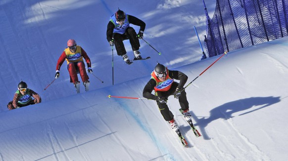 Michael Schmid of Switzerland, right, Andreas Matt of Austria, 2nd right, Christopher Del Bosco of Canada, left and Audun Groenvold of Norway, 2nd left compete in the men&#039;s skicross final at the  ...