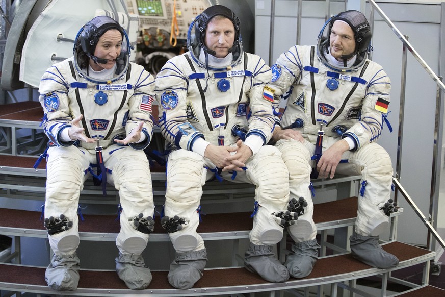 From left: U.S. astronaut Serena Aunon-Chancellor, Russian cosmonaut Sergey Prokopyev‎ and German astronaut Alexander Gerst speaks to press before their final preflight practical examination in a mock ...