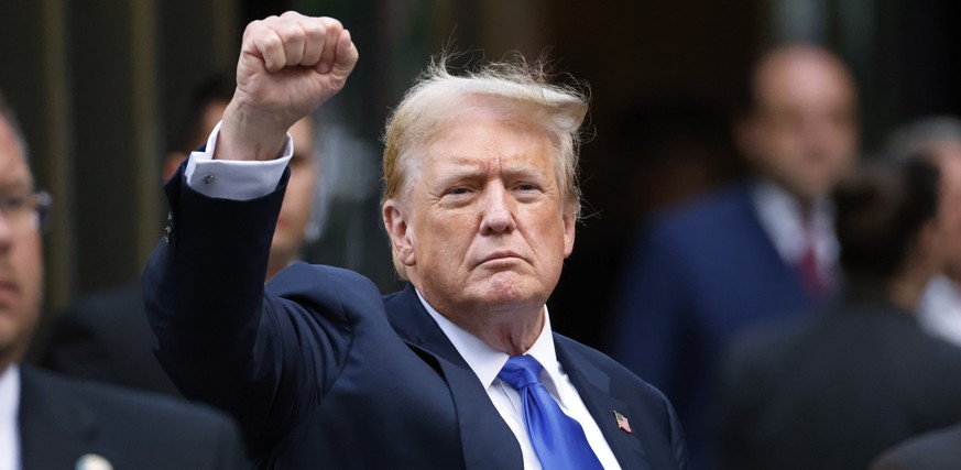 epaselect epa11380690 Former US President Donald Trump gestures to the media and the crowd outside of Trump Tower after a jury found him guilty on all 34 counts in his criminal trial in New York State ...