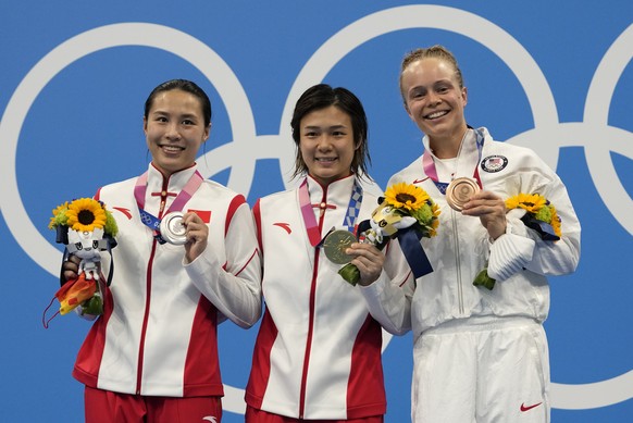 Shi Tingmao of China, gold medal, center, Wang Han of China silver medal, left, and Krysta Palmer of the United States&#039; bronze medal pose for a photo after women&#039;s diving 3m springboard fina ...