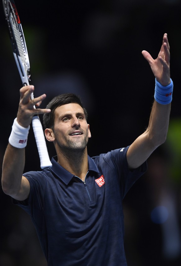 epa05638943 Serbia's Novak Djokovic celebrates winning his Men's singles semi final match against Japan's Kei Nishikori at the ATP World Tour finals tennis tournament at the O2 Arena in London, Britain, 19 November 2016. EPA/WILL OLIVER