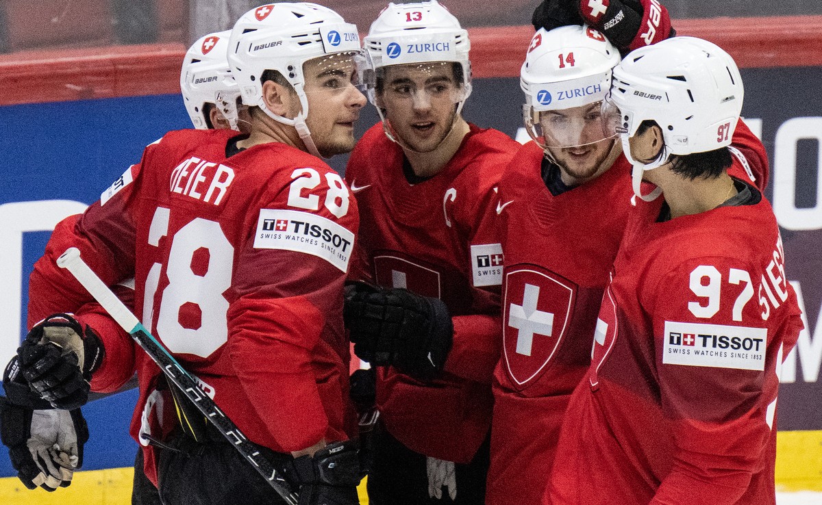 Switzerland's Timo Meier, Nico Hischier, Dean Kukan and Jonas Siegenthaler, from left, celebrate their fifth goal during the Ice Hockey World Championship group A preliminary round match between  ...