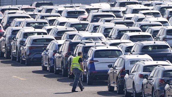 New German cars are stored at a logistic center in Duisburg, Germany, Thursday, March 27, 2025. (AP Photo/Martin Meissner)
Germany Cars US Tariffs