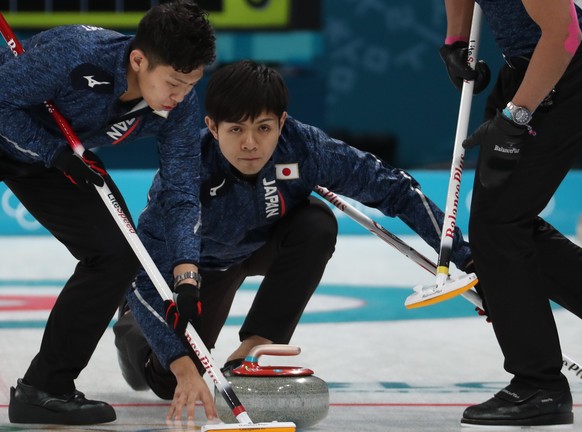 epa06532342 Yusuke Morozumi (R) and Kosuke Morozumi (L) of Japan in action during Men&#039;s Round Robin Session Japan against Switzerland inside the Gangneung Curling Centre at the PyeongChang Winter ...