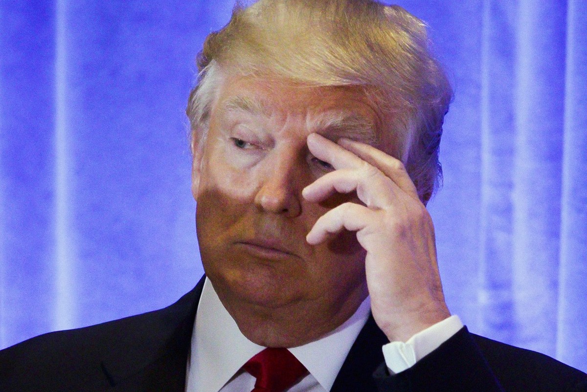 epa05720792 (FILE) - US President-elect Donald Trump looks out at the press during a press conference in the lobby of Trump Tower in New York, New York, USA, 11 January 2017 (reissued 16 January 2017) ...