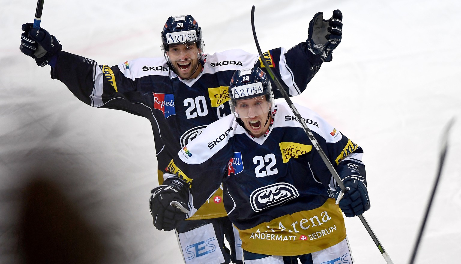 Ambri&#039;s player Diego Kostner right celebrate the 1 - 0 goal with Ambri&#039;s player Elias Bianchi right, during the preliminary round game of National League Swiss Championship 2018/19 between H ...